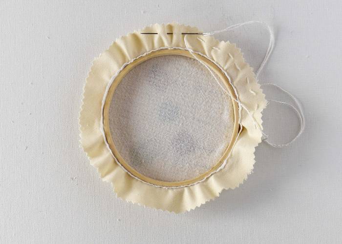 Running stitch around trimmed edge